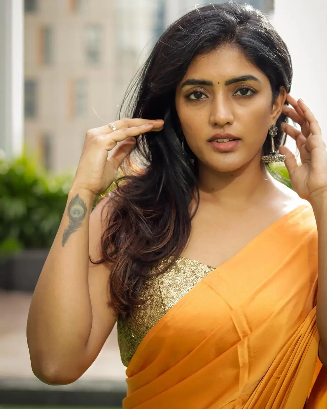 Eesha Rebba Charming Stills In Orange Saree Sleeveless Blouse